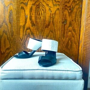 Black heel with white snakeskin strap